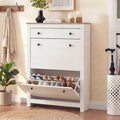 [White] Hallway shoe storage unit with bottom door open displaying pairs on built-in racks beside umbrella stand
