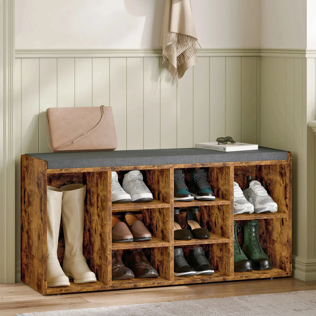 [White] Pair of shoe storage benches lining hallway wall with cushions, boots and shoes filling cubbies
