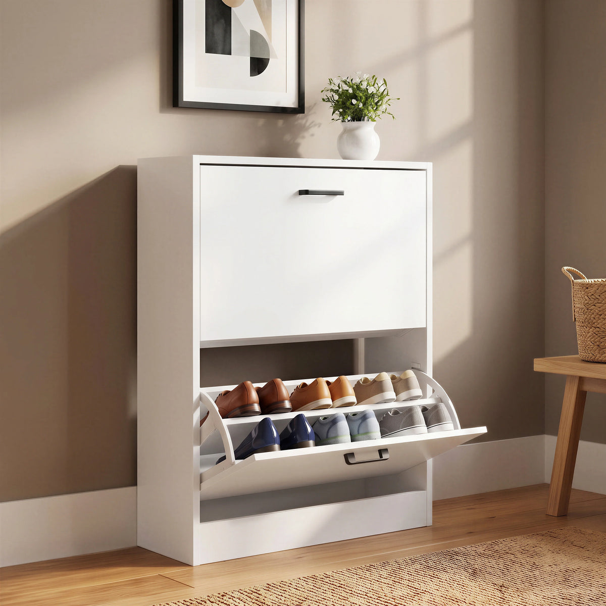 [White] White shoe cabinet 2 door with top pull-down drawer open; decor and planter on the cabinet top